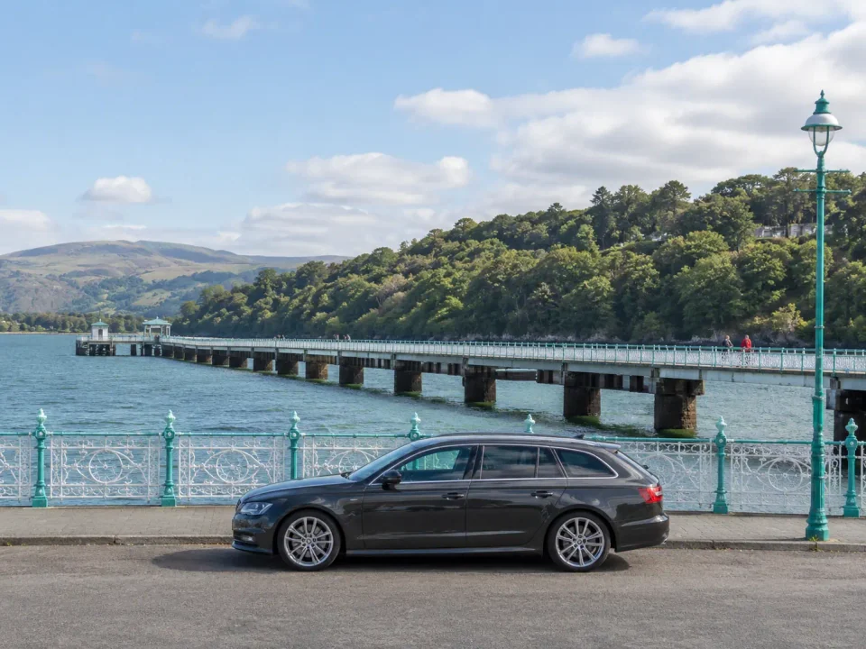 Executive estate car beside Garth Pier and the Menai Strait in Bangor