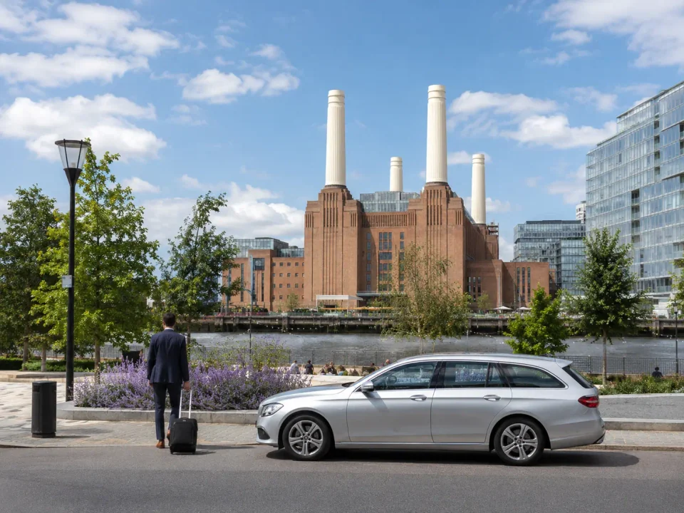 Executive estate car beside the Thames overlooking Battersea Power Station