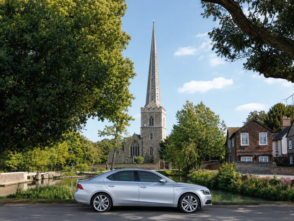 Executive saloon beside St Mary's Church and the River Cray in Bexley