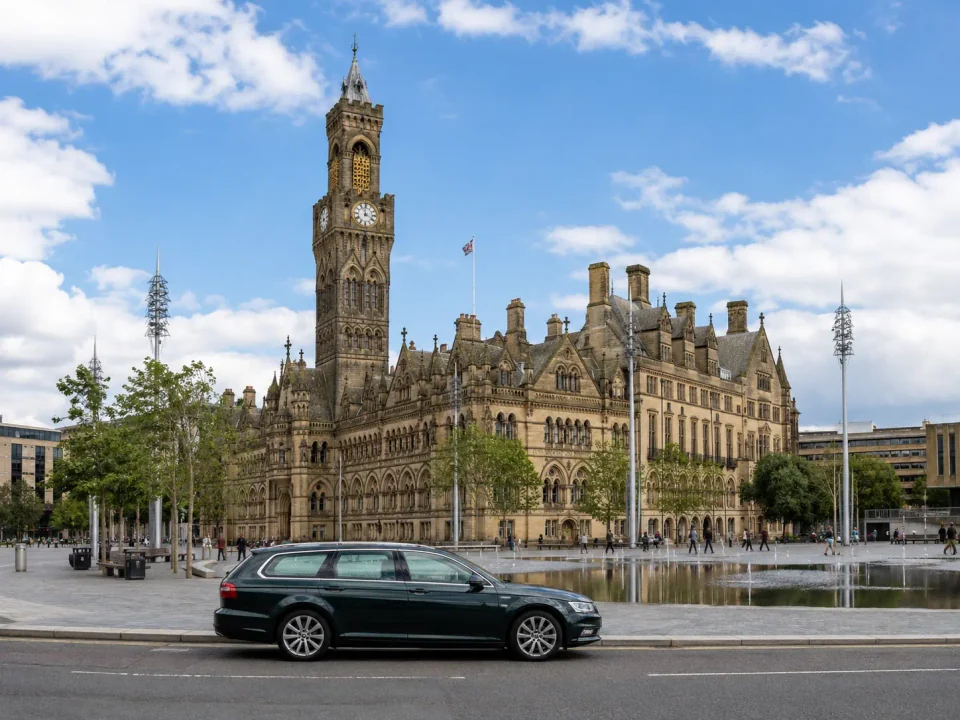 Executive estate car outside Bradford City Hall and Centenary Square