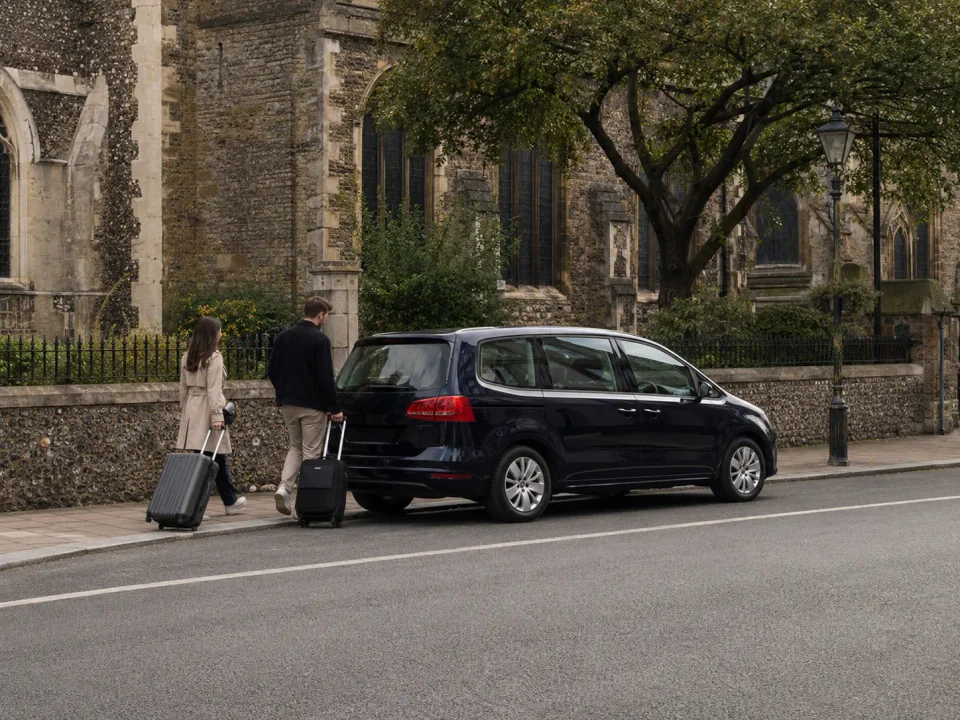 Airport transfer vehicle stopped at the kerb near Chelmsford Cathedral
