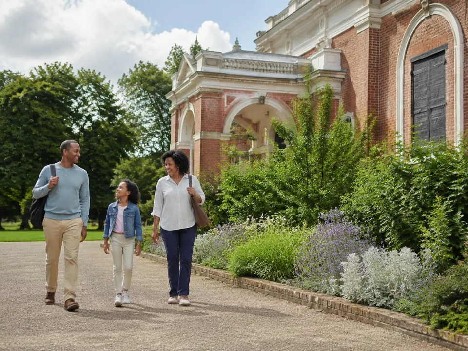 Family walking through the gardens beside Dulwich Picture Gallery