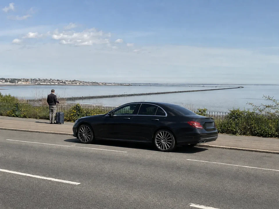 Airport transfer vehicle parked at the kerb near Southend seafront