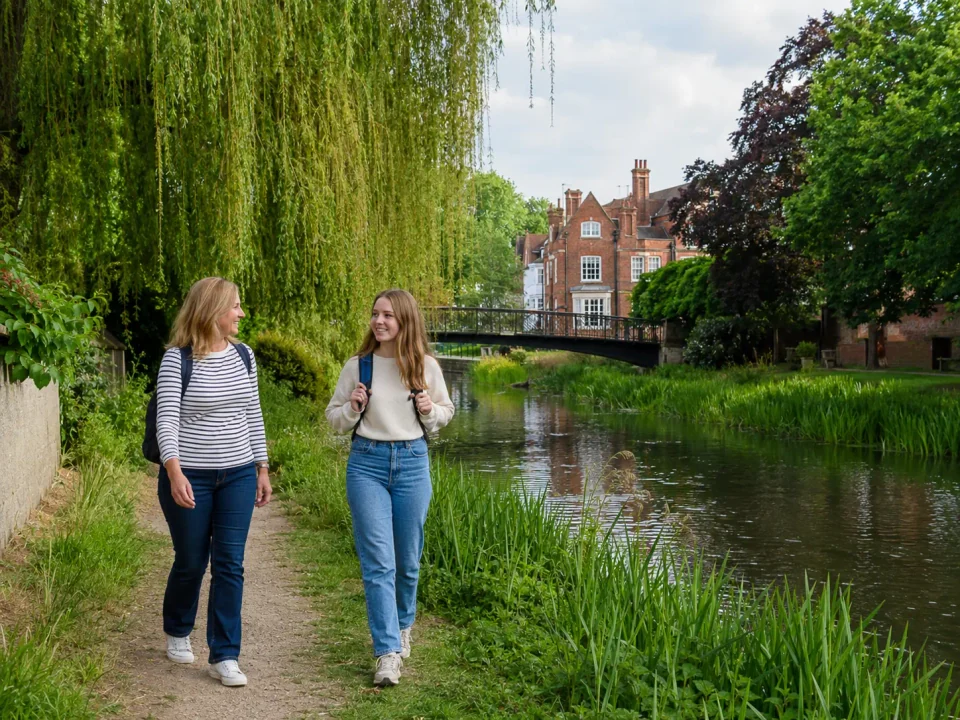 Family visitors walking beside the river through Witham River Walk