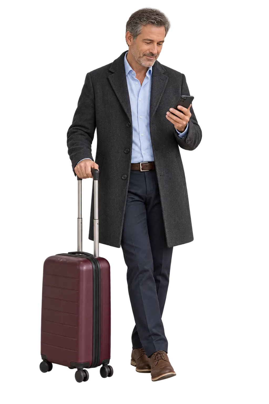 Traveller checking his phone beside a burgundy suitcase