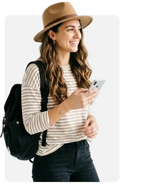 Woman wearing a brown fedora and backpack.